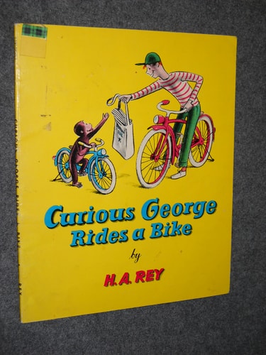 Curious George Rides a Bike