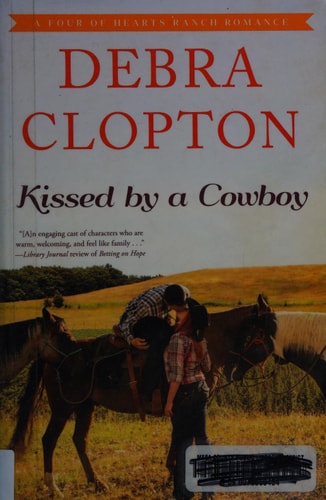 Kissed by a Cowboy (A Four of Hearts Ranch Romance)